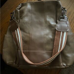 Brown backpack with shoulder strap
